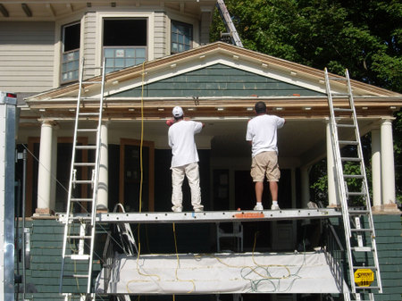 Two Men Painting House