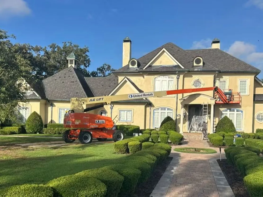Large Lakeland estate home having its exterior repainted with lift access by Mike's Painting