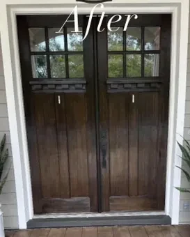 The same front doors after refinishing in a rich dark stain