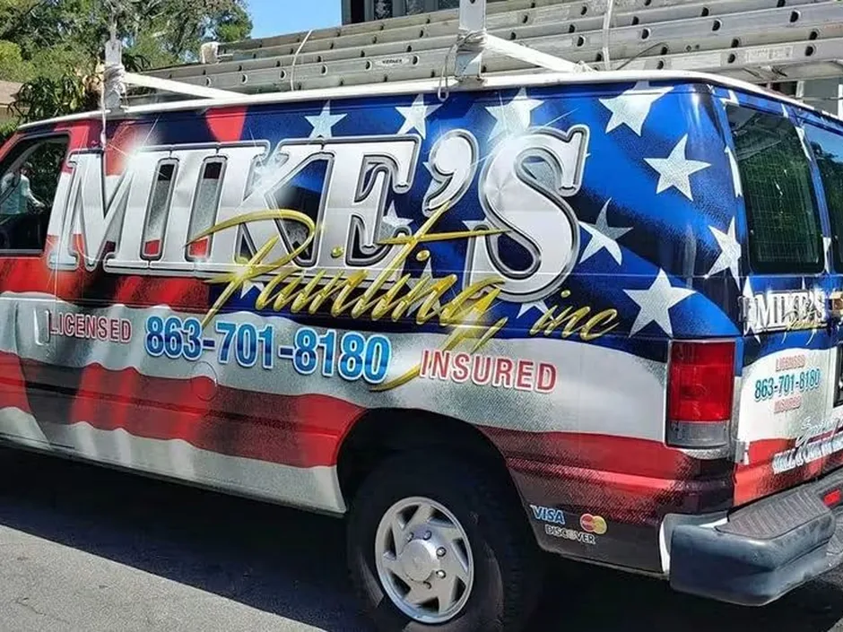 Mike's Painting flag-wrapped work van parked at a Lakeland job site